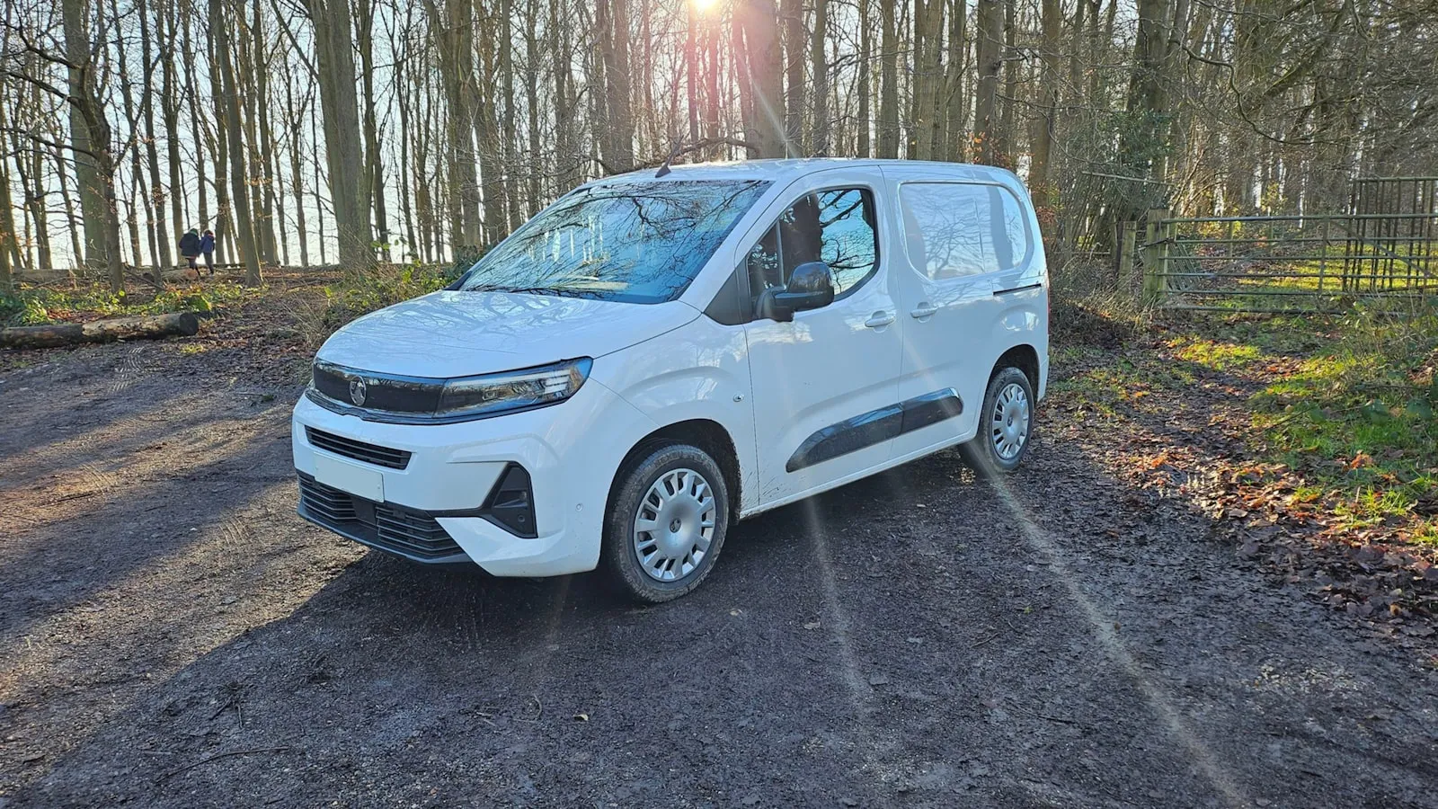 A white work van parked outdoors